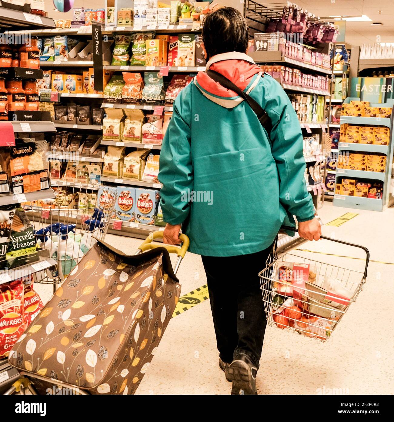 London UK, March 17 2021, Woman Shopping Alone In Waitrose Supermarket Stock Photo