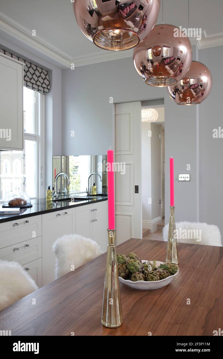 Kitchen and dining room with sliding door pulled halfway |  | Designer: Jess Lavers Design Stock Photo