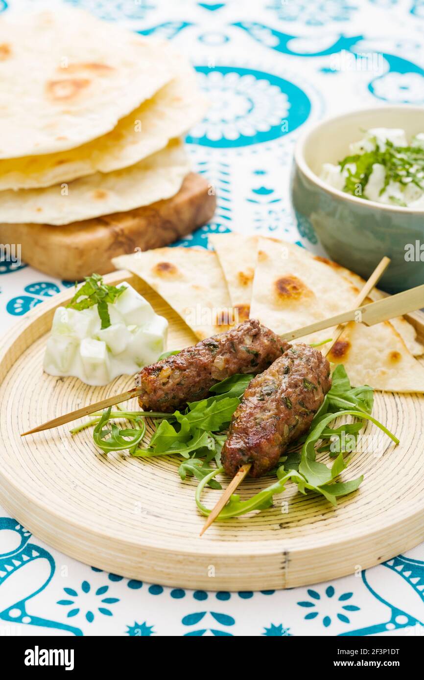 Lamb Kofta with rocket leaves served with minted potato salad and