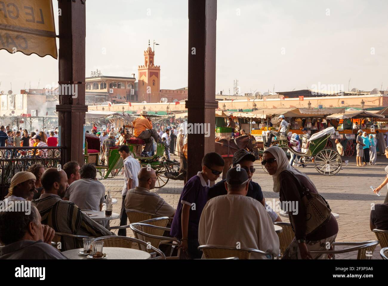 Customers in a cafe in Marrakesh in front of Jamaa El Fna market square Stock Photo