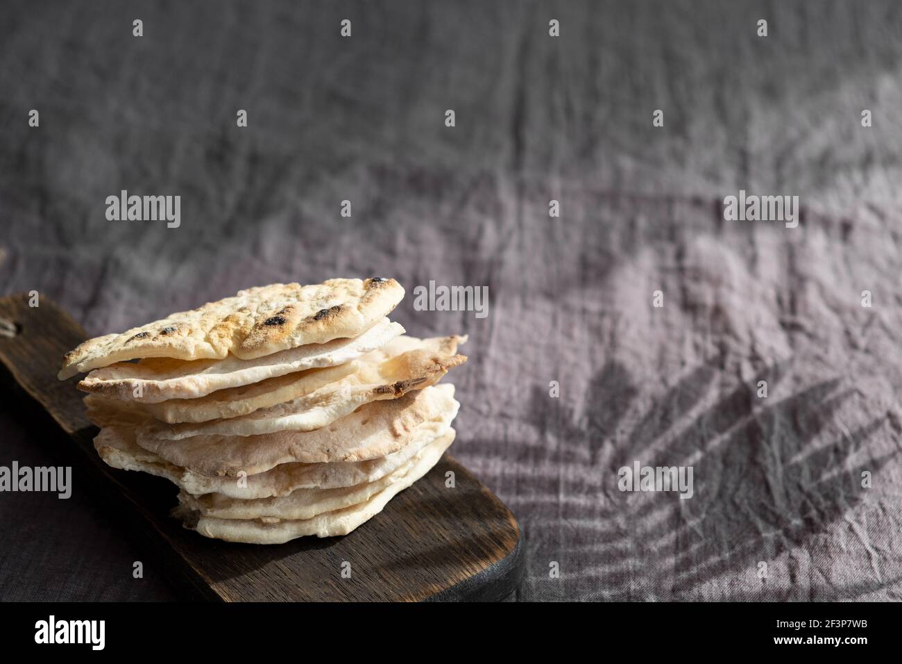 Homemade matzo with microgreen peas. Unleavened flatbread bread. Pesah