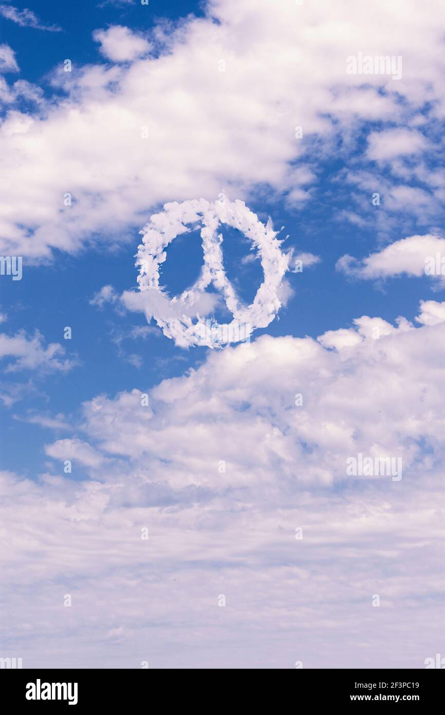 Peace symbol made of clouds over cloudy sky Stock Photo