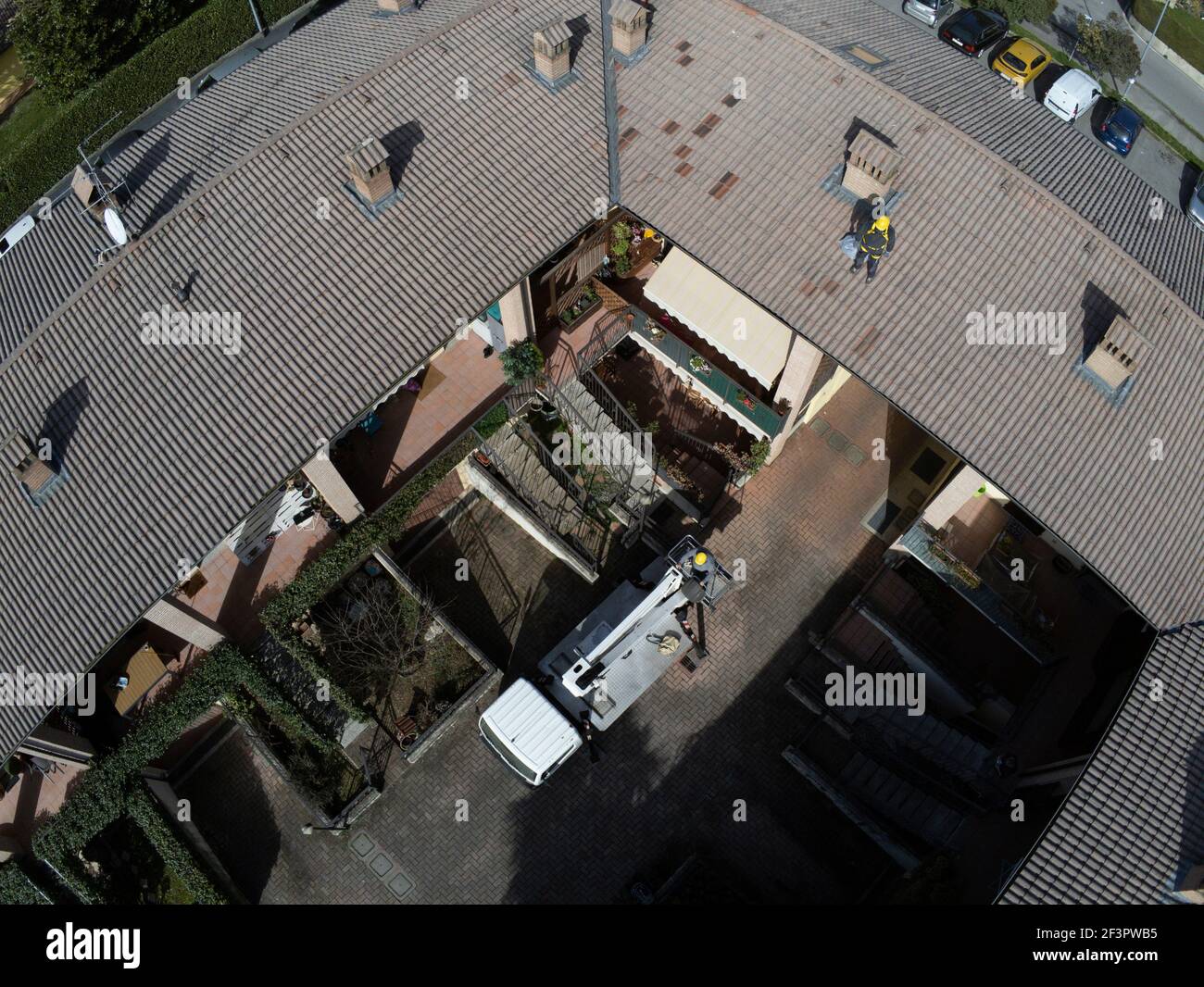 Roof inspection job with platform and worker working on the roof Stock