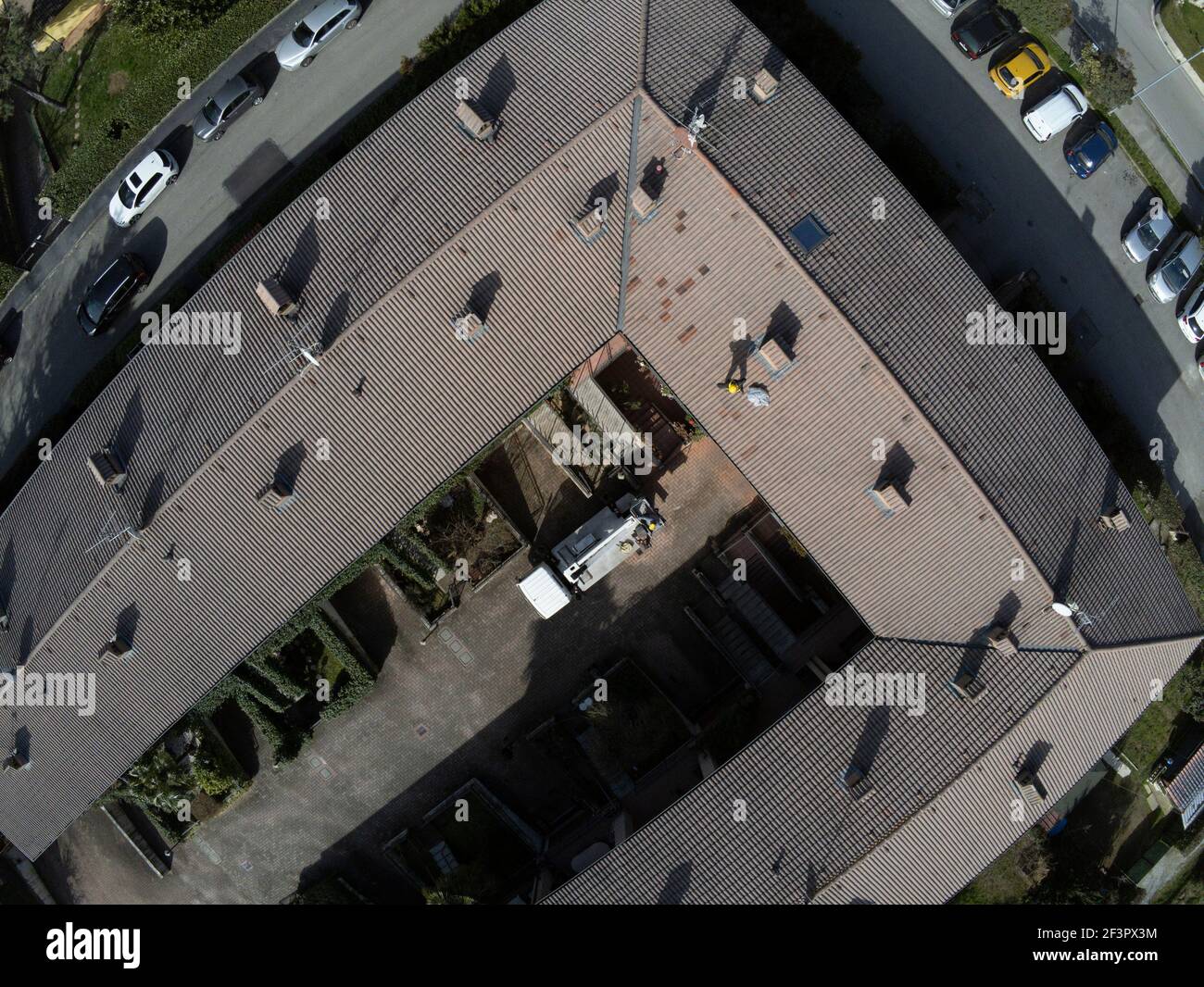 Roof inspection job with platform and worker working on the roof Stock