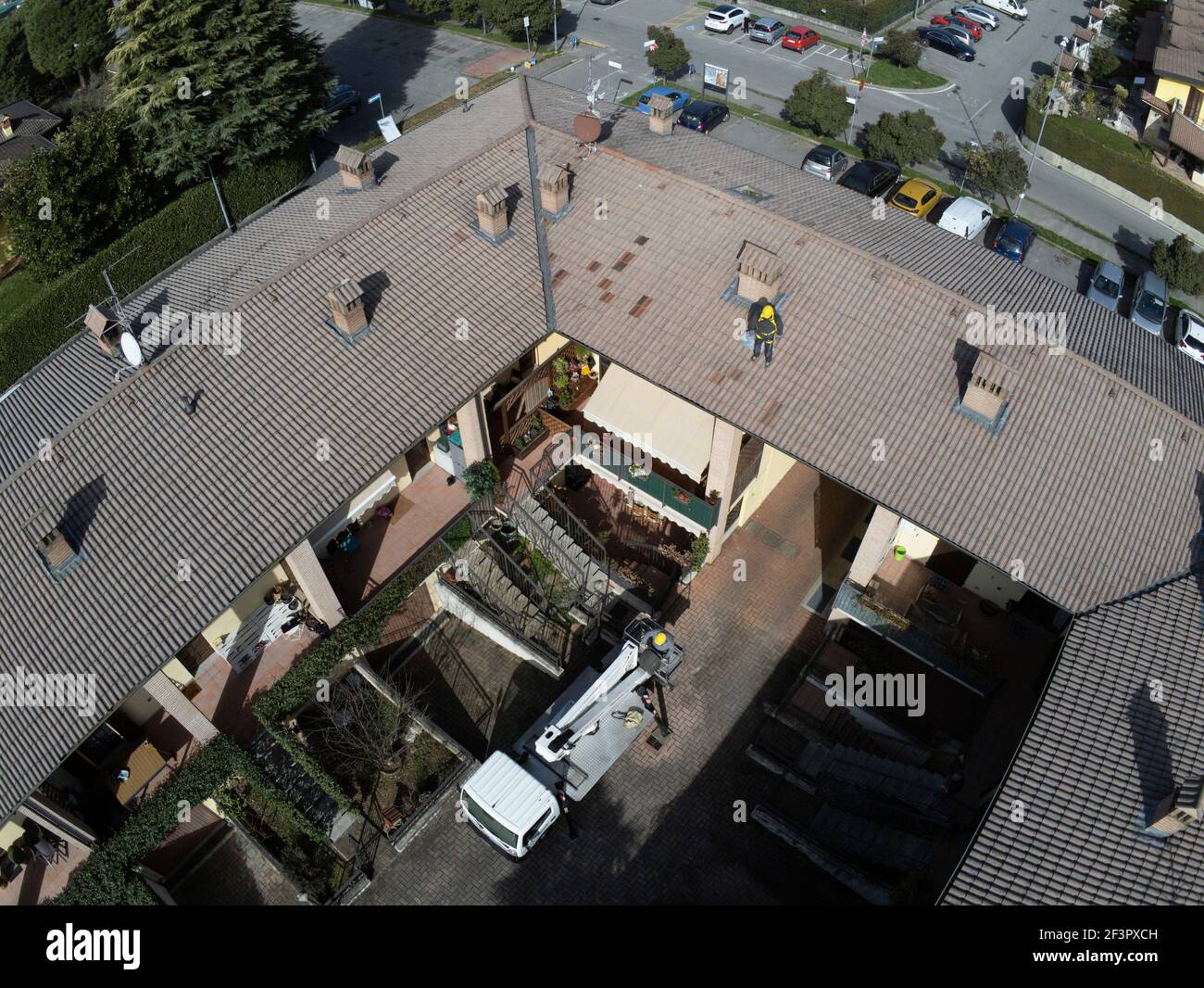 Roof inspection job with platform and worker working on the roof Stock