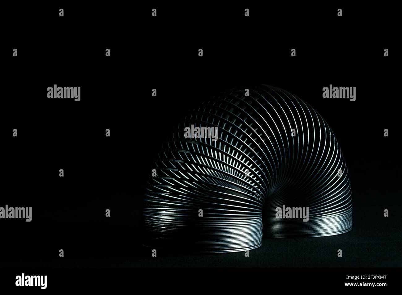 Abstract metal spirals with black background Stock Photo - Alamy