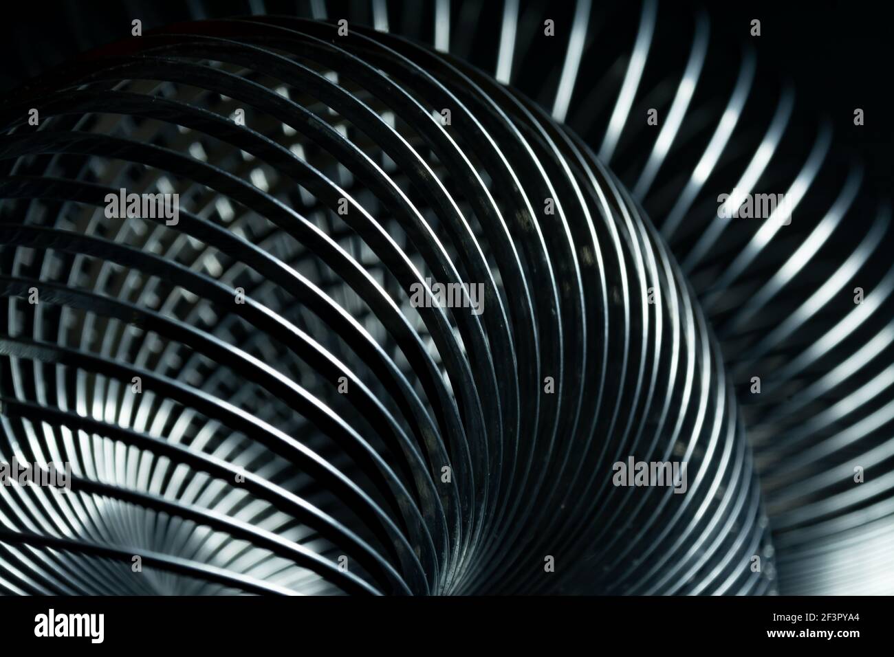 Abstract metal spirals with black background Stock Photo - Alamy
