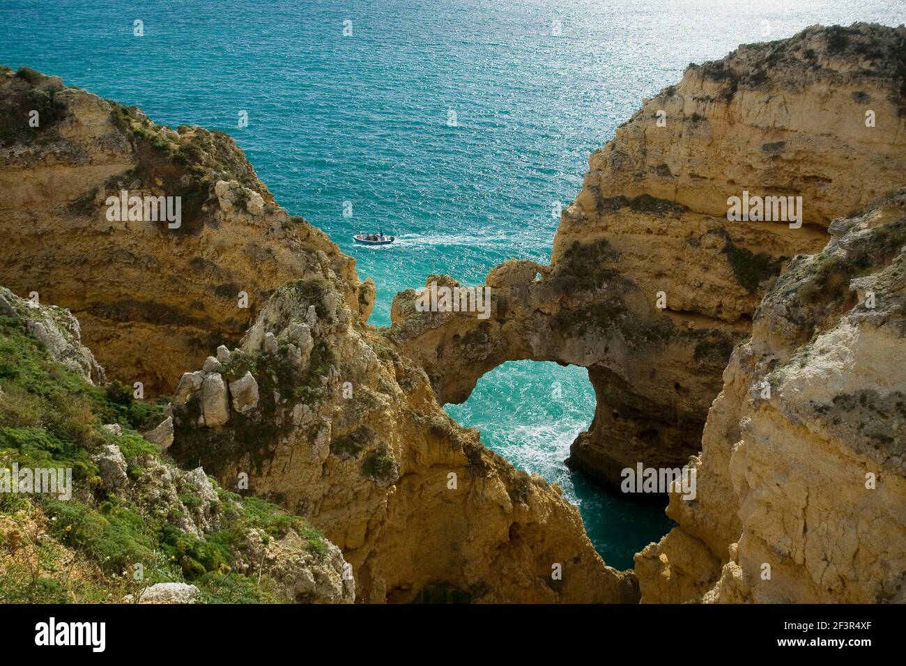 Arched natural rock formation in Ponta da Piedade, Mercy Point, Lagos, Portugal Stock Photo