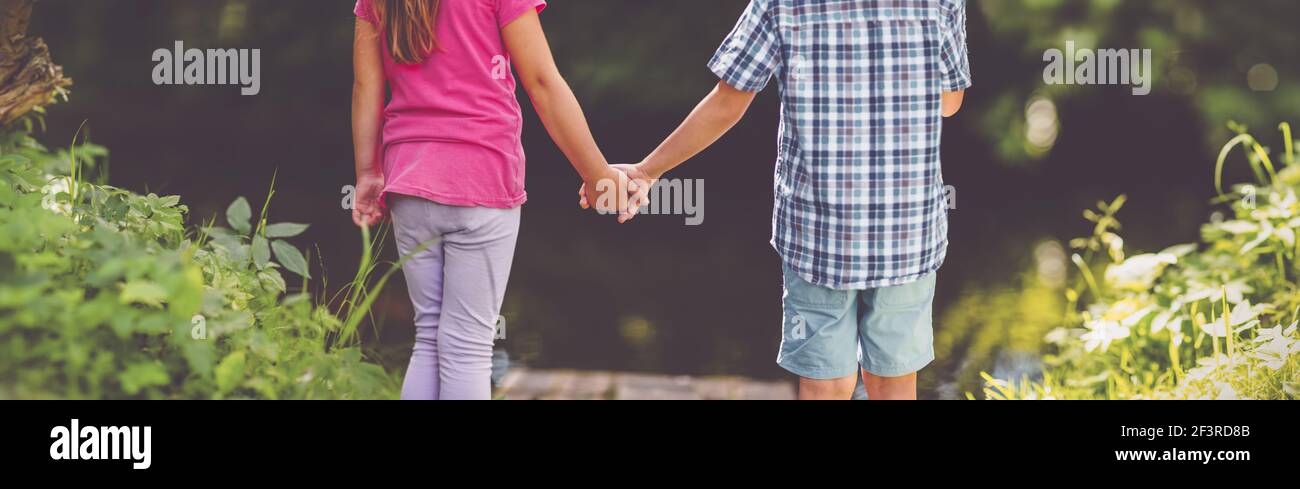 Girl boy holding hands hi-res stock photography and images - Alamy