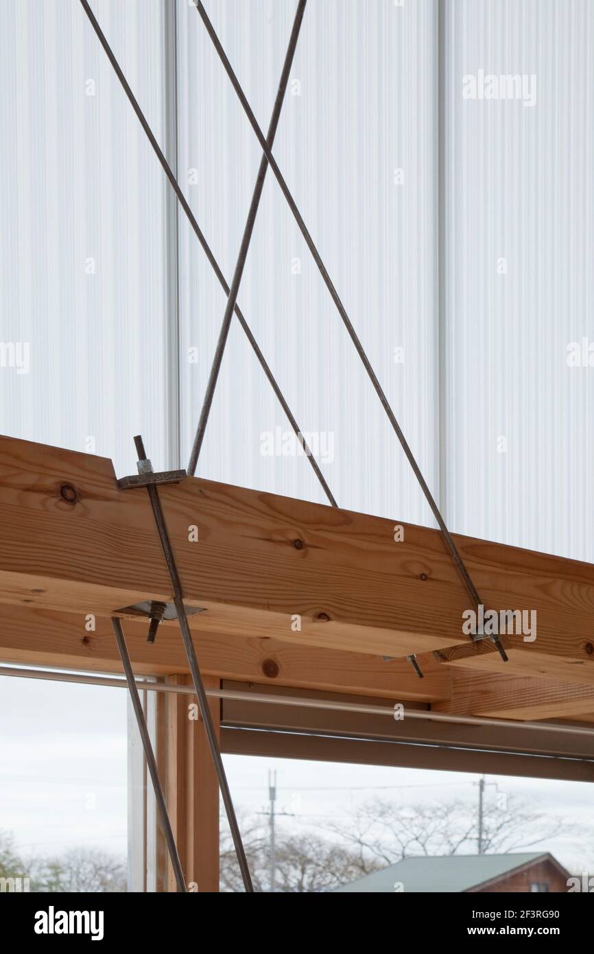 HAN-KYO, Weekend Cabin, Close-up of the wooden beams and round steel rod bracing, the multi-layer polycarbonate Stock Photo