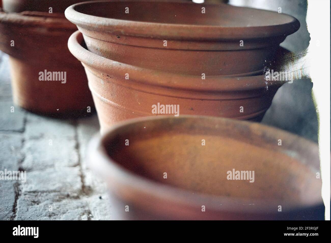 Ready for flowers. Empty flower pots. Defocused background. Film grain texture. Close up Stock Photo