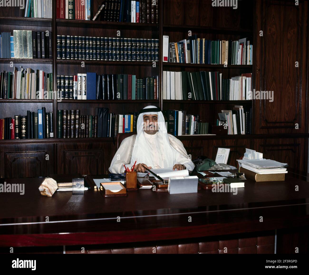 Saudi Arabia Businessman Sitting at Desk in Office Stock Photo Alamy