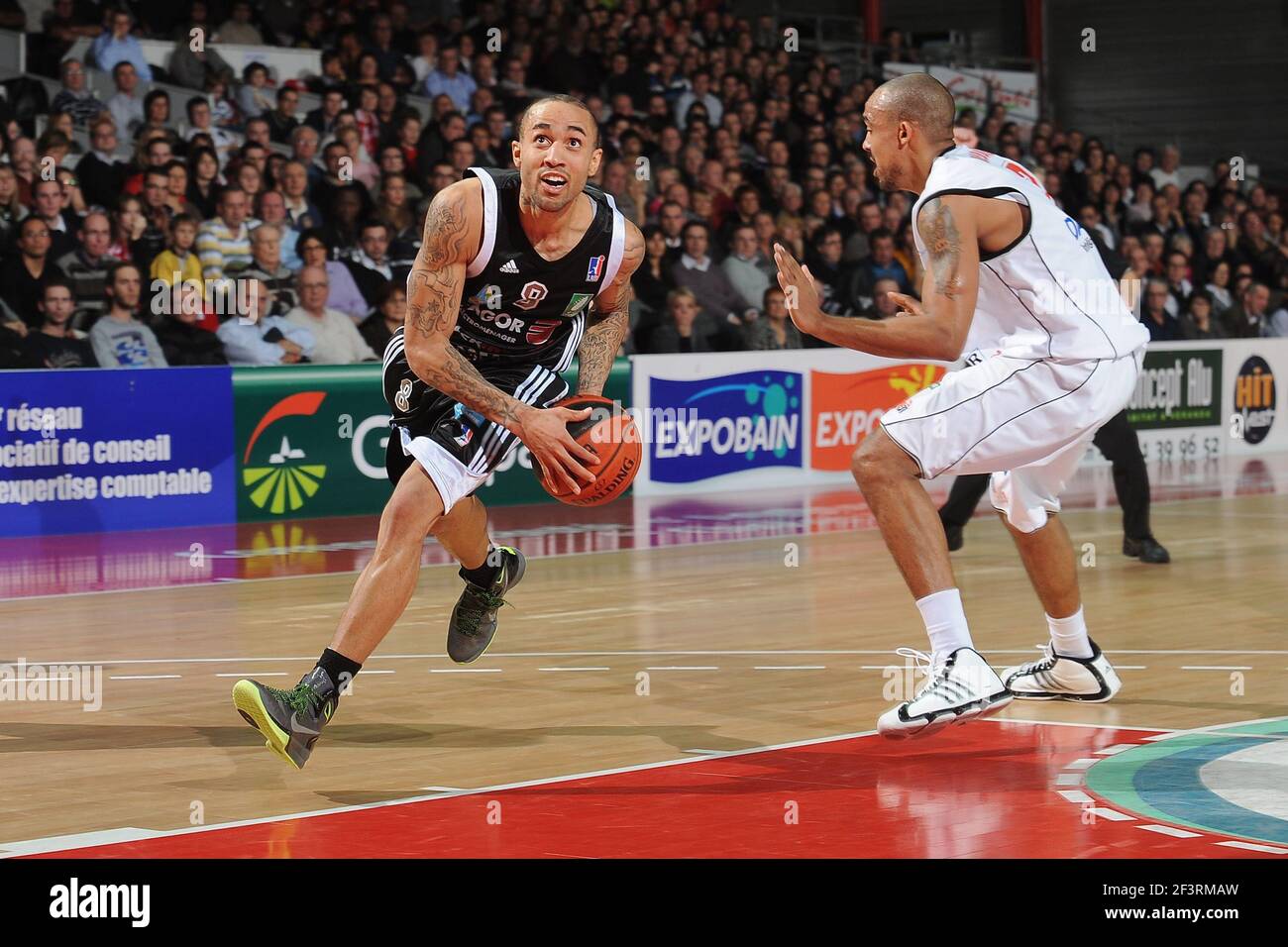 BASKETBALL - FRENCH CHAMPIONSHIP PRO A 2010/2011 - CHOLET (FRA) -  08/01/2011 - PHOTO : PASCAL ALLEE / HOT SPORTS / DPPI - CHOLET V LIMOGES -  8 Zack WRIGHT / CSP LIMOGES 2010/2011 - 7 Luc-Arthur VEBOBE /CHOLET BASKET  Stock Photo - Alamy