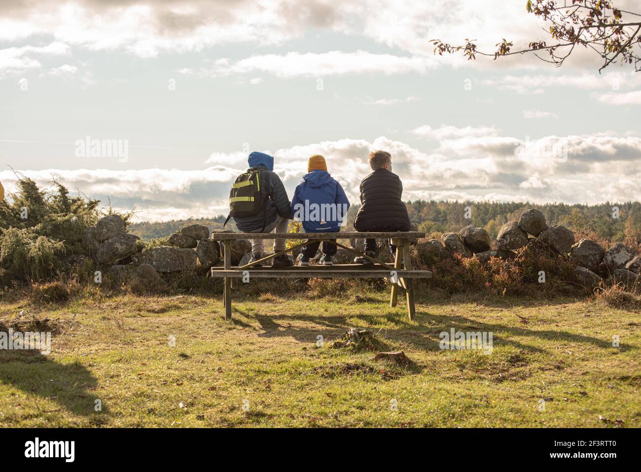 Man bench sitting park kids hi-res stock photography and images - Alamy