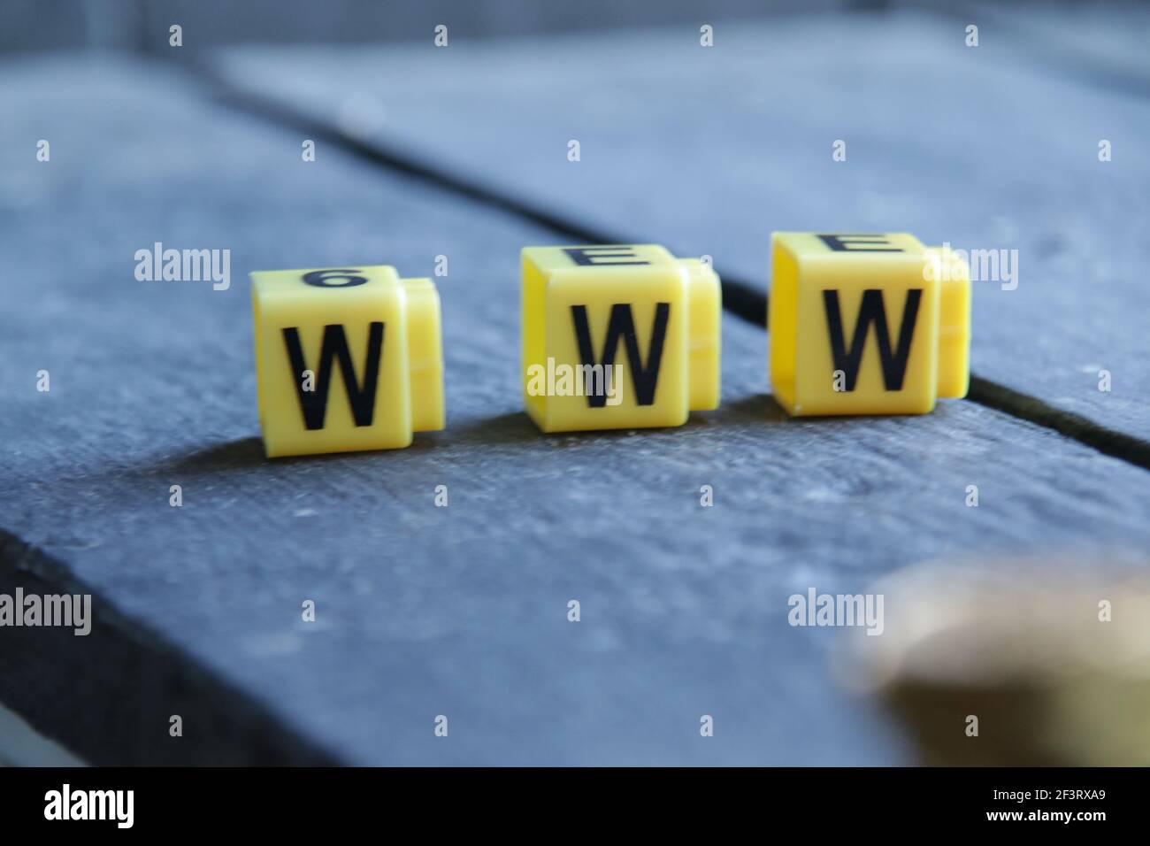 Text Www. Yellow letters on vintage background. Stock Photo