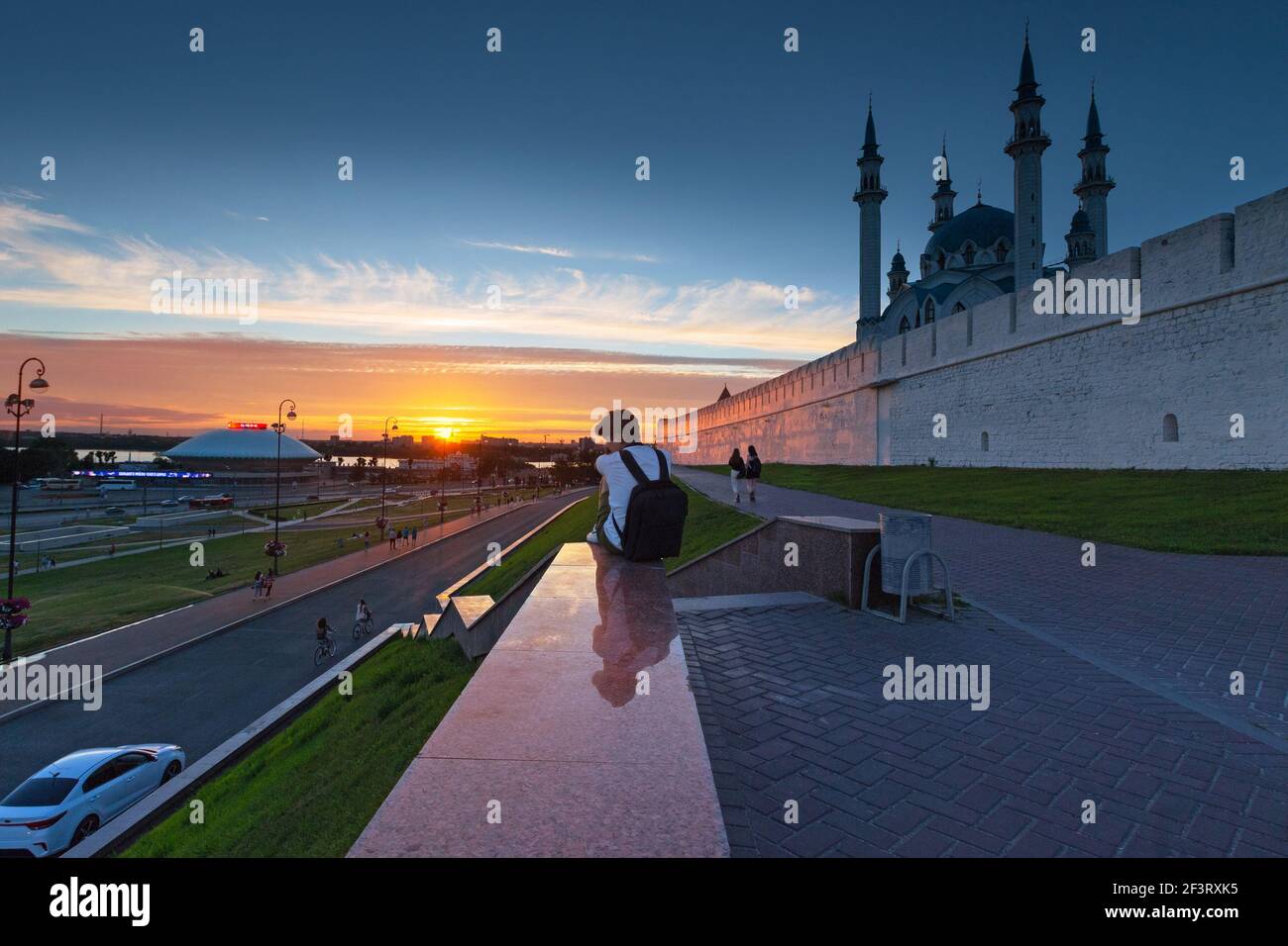 The wall of the Kazan Kremlin outside, illuminated by the sunset, people on a walk. Russia, Kazan 24 June 2019 Stock Photo