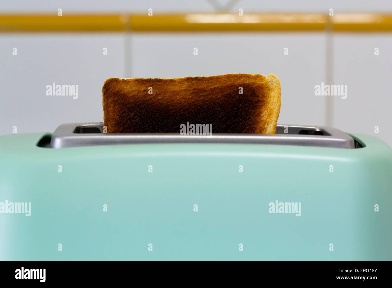 Burnt toast jumping out of the toaster Stock Photo Alamy