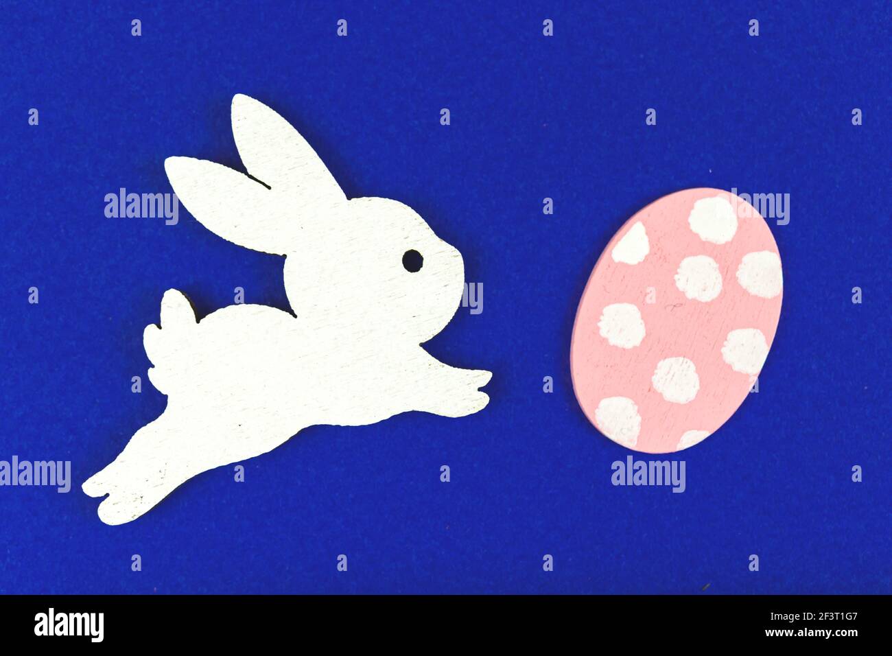 Easter bunny with easter painted egg, top view and flat lay composition Stock Photo