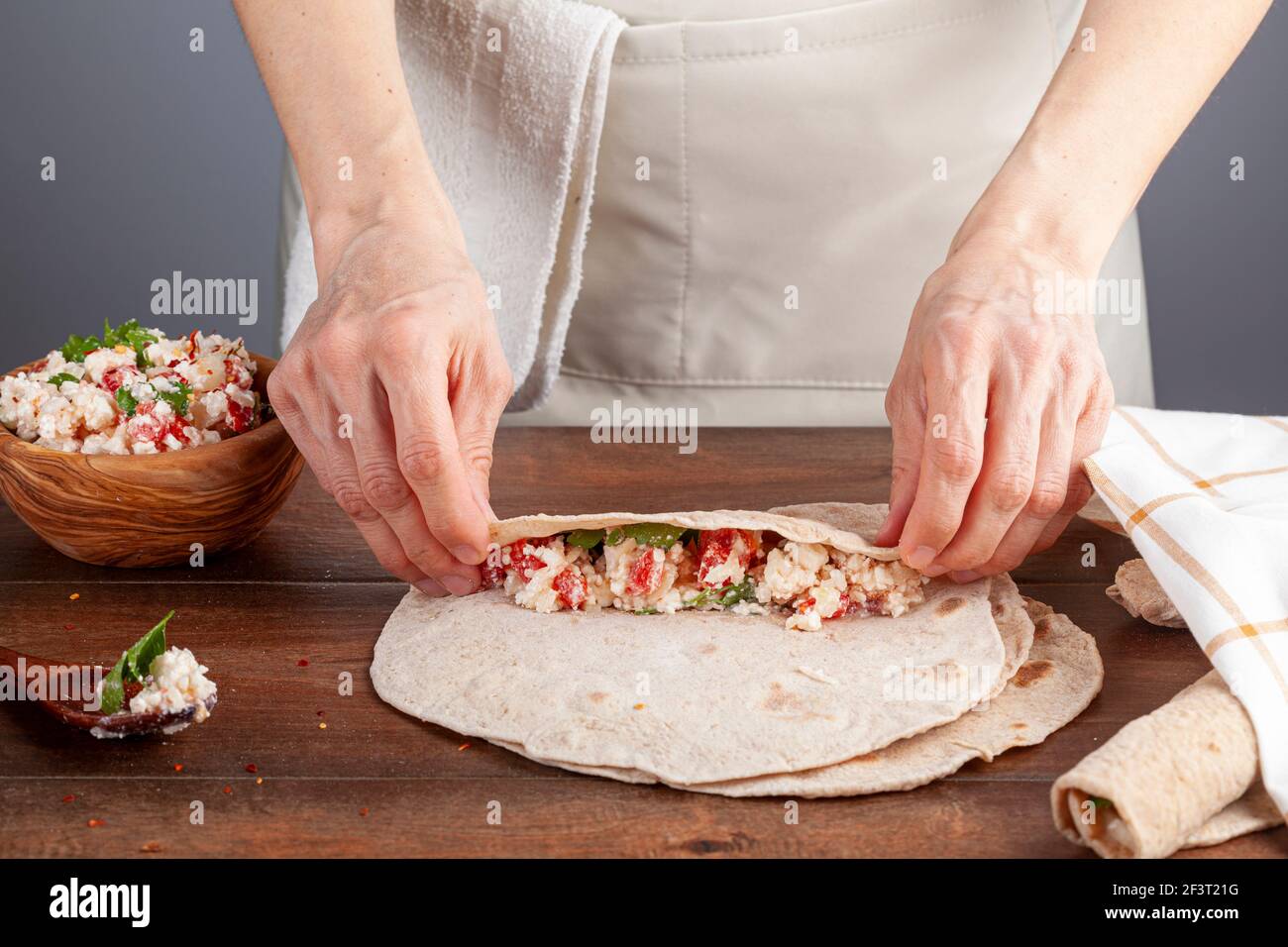 Sikma is a traditional Turkish wrap in mediterranean coast of silifke, mersin. Flat bread known as bazlama is laid and filled with mixture of cheese, Stock Photo