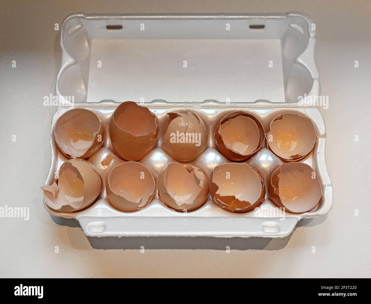Cracked Eggs Broken Eggshells in Box Package Stock Photo