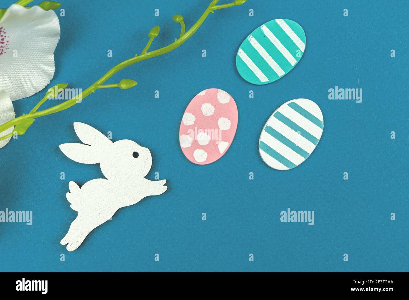 Cute Easter bunny with easter eggs, flat lay and creative composition with holiday decoration Stock Photo