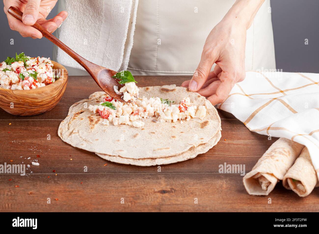 Sikma is a traditional Turkish wrap in mediterranean coast of silifke, mersin. Flat bread known as bazlama is laid and filled with mixture of cheese, Stock Photo