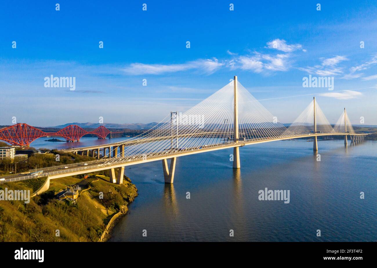 Aerial view from Rosyth showing three bridges spanning the Firth of Forth. The Queensferry Crossing, Forth Road Bridge and Forth Rail Bridge. Stock Photo