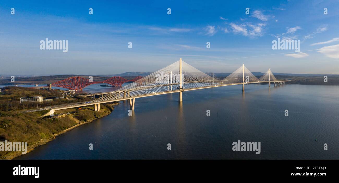 Aerial view from Rosyth showing three bridges spanning the Firth of Forth. The Queensferry Crossing, Forth Road Bridge and Forth Rail Bridge. Stock Photo