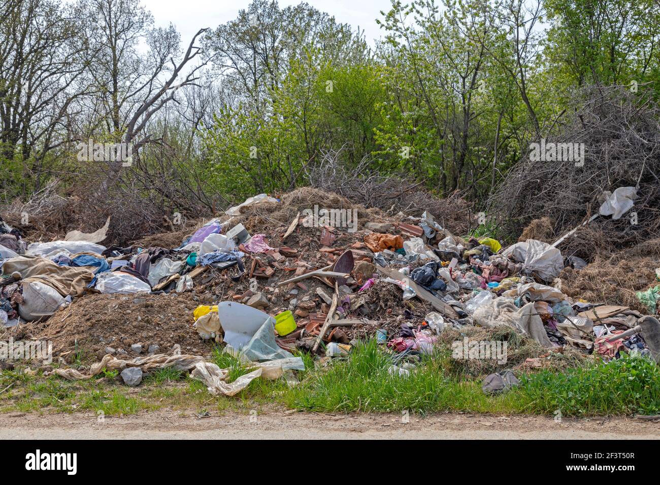 Illegal Dump Site at Side of Road Environment Pollution Problems Stock Photo