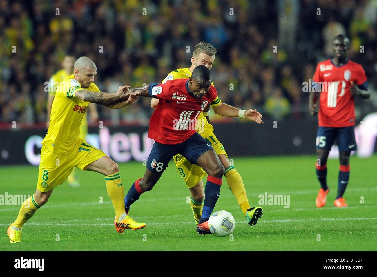 Football - French Championship 2013/2014 - Ligue 1 - FC Nantes v Lille OSC  on October 25 2013 in Nantes , France - Photo Pascal Allee / DPPI - SALOMON  KALOU (LILLE) / VINCENT BESSAT (L) AND LUCAS DEAUX (R Stock Photo - Alamy