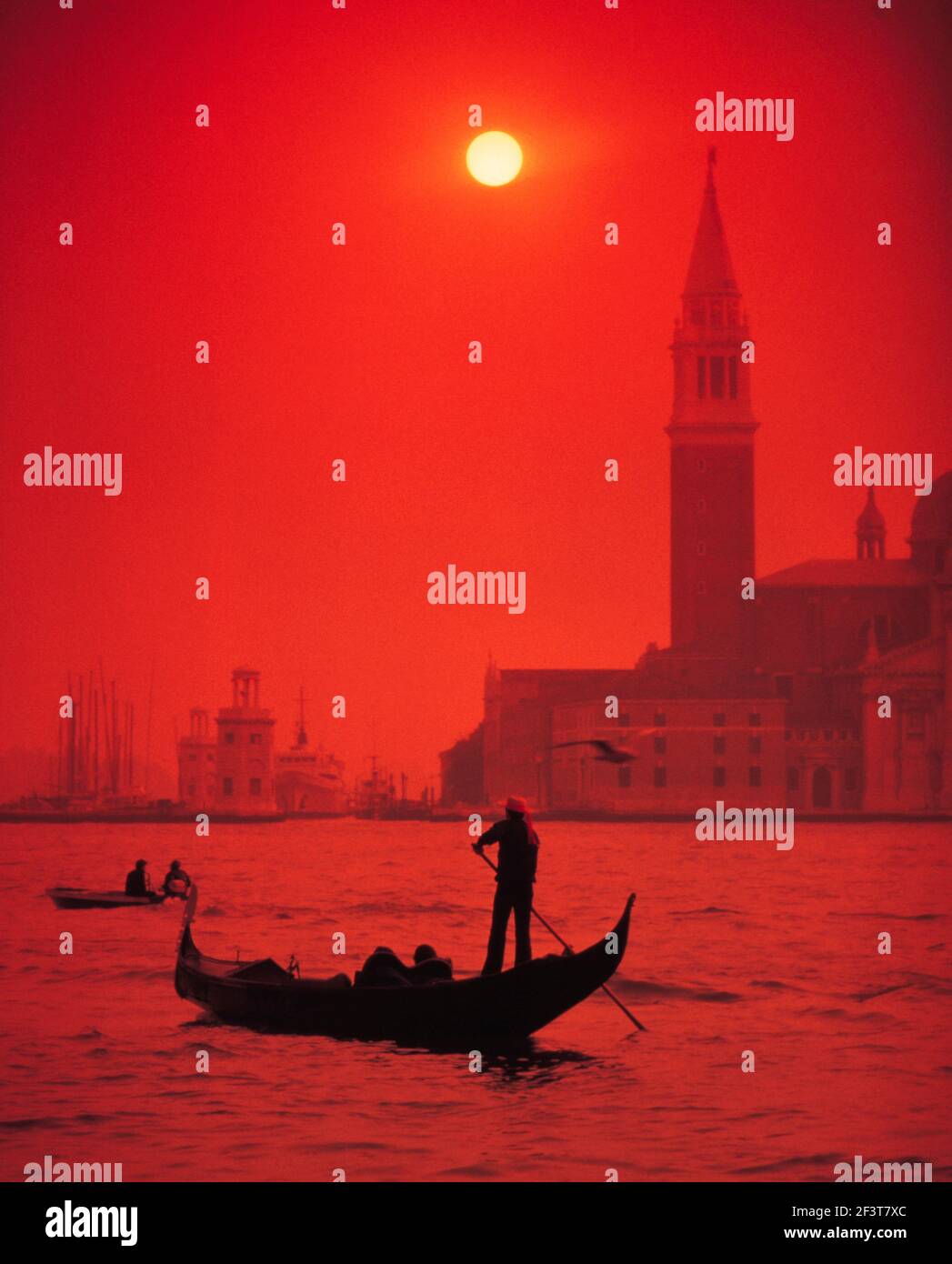 Italy. Venice. Gondolier at sunset. Stock Photo