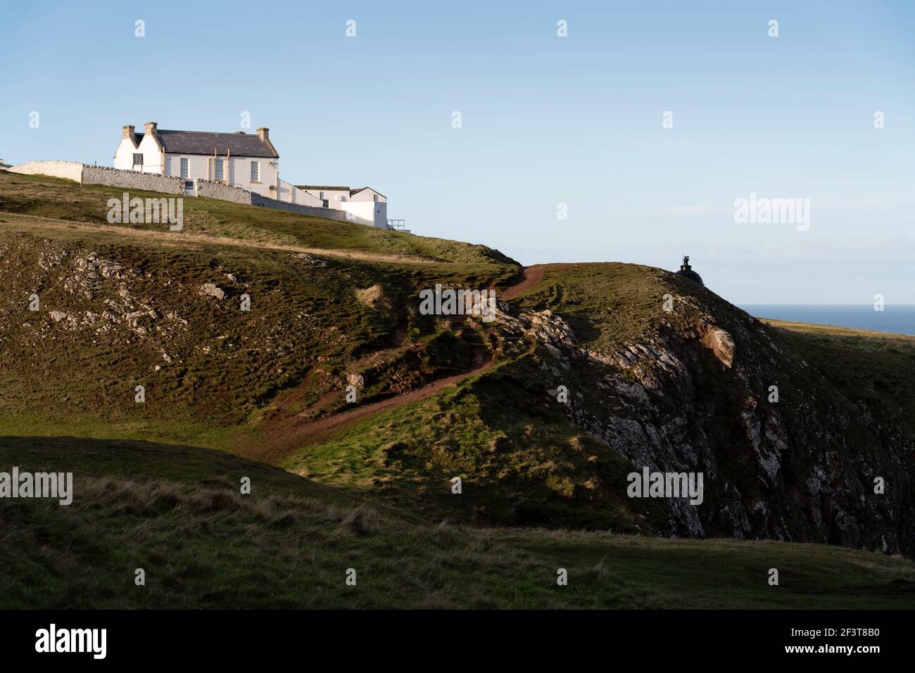 St Abbs, Berwickshire, Scotland - North Sea fishing village and nature reserve - Lighthouse and cottage Stock Photo