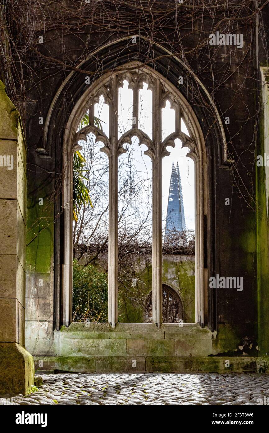 The Shard seen through the remains of a gothic arched window og St Dunstan in the East - Stock Image