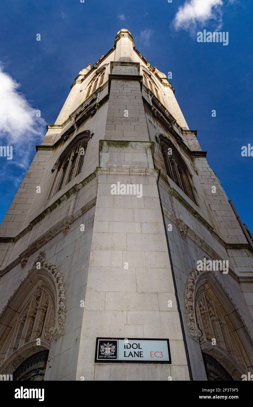 Looking up at the tower of St Dunstan in the East from Idol Lane, one of the adjoining streets - Stock Image