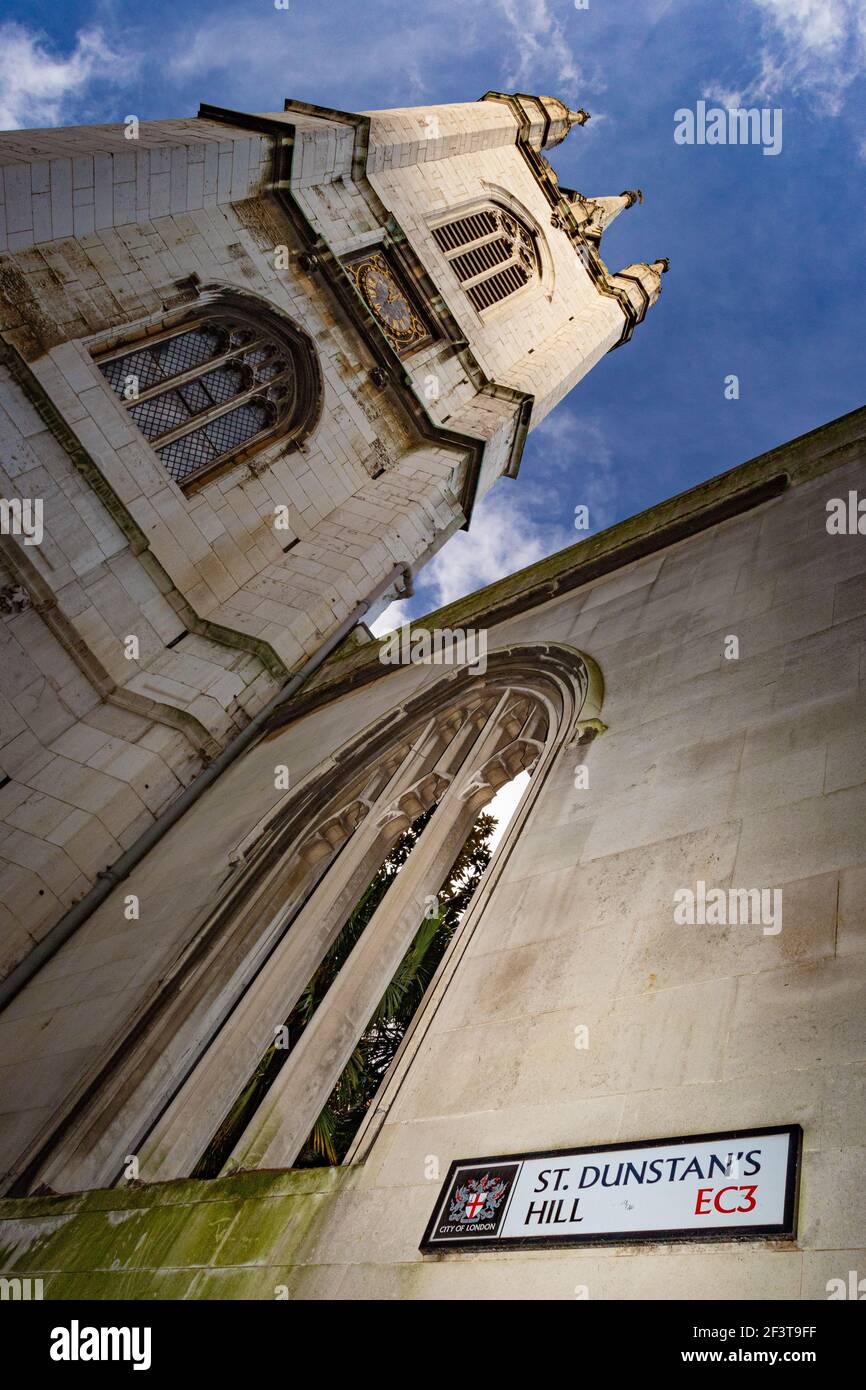 Looking up at the tower of St Dunstan in the East from St Dunstan's Hill, one of the adjoining streets - Stock Image