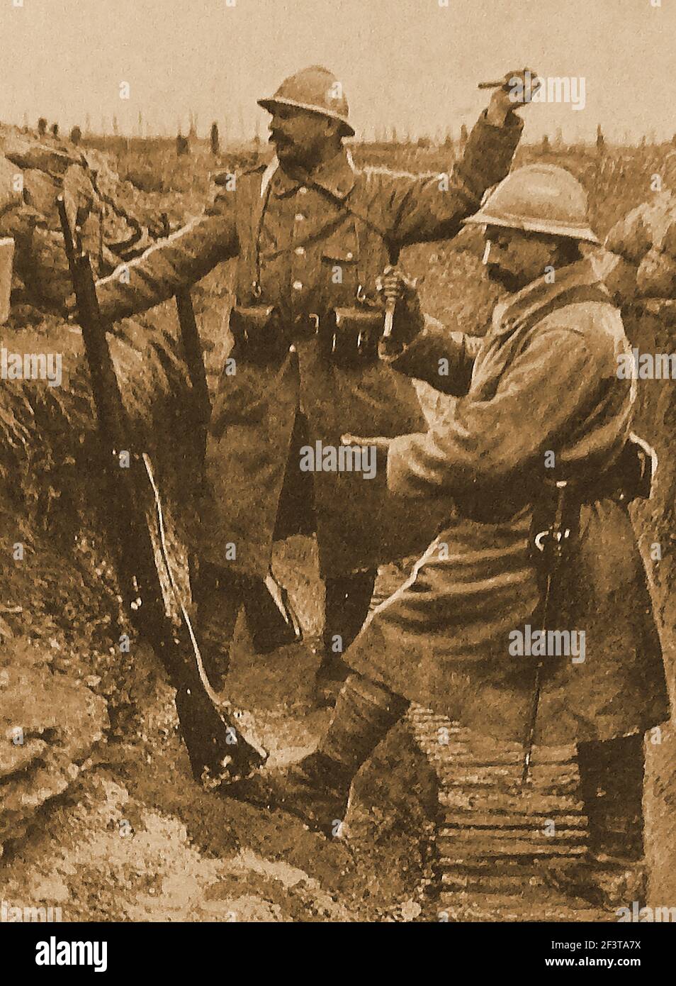 WWI - Trench warfare - French soldiers before Verdun throwing hand grenades across the neutral zone to the German lines. Stock Photo