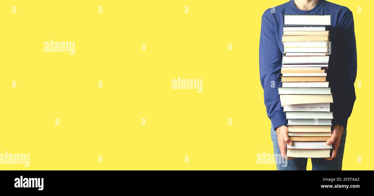Student with books on a blank colored banner background. Education ...