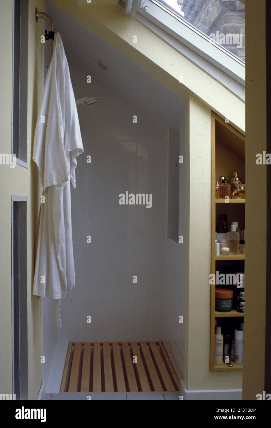 Shower fitted into space under eaves of attic Stock Photo Alamy