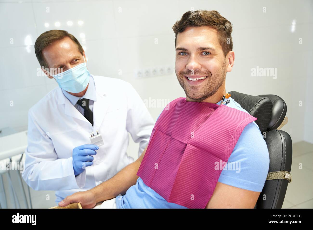 Happy patinet of dental clinic during a dentist appointment Stock Photo