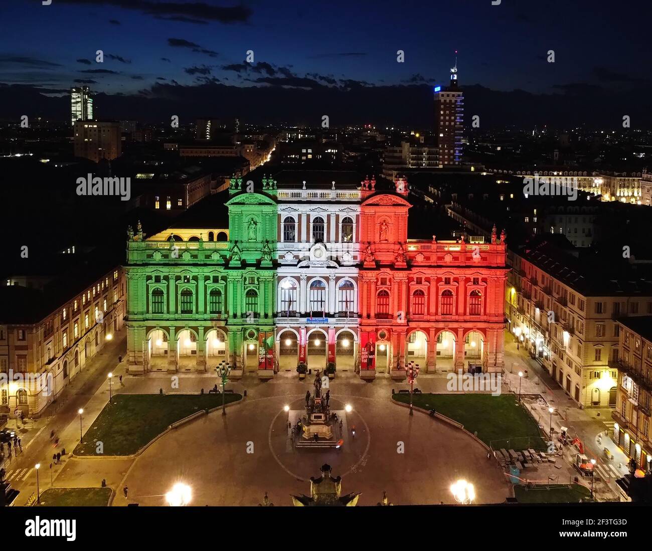 National Museum of the Italian Risorgimento with the façade illuminated by the colours of the Italian flag. Turin, Italy - March 2021 Stock Photo