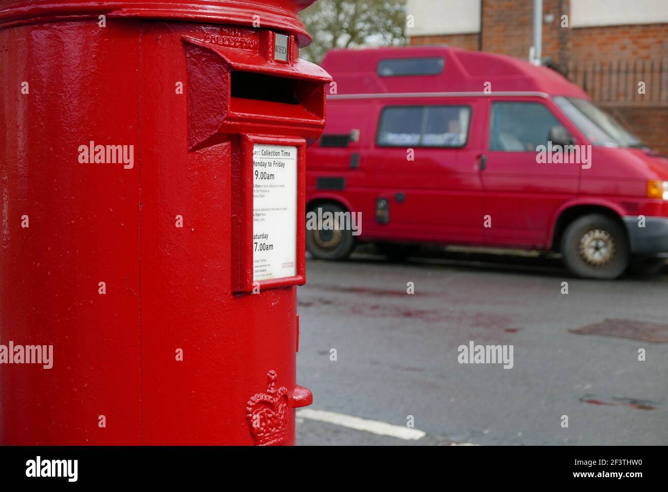 Red Letter box and red van Stock Photo