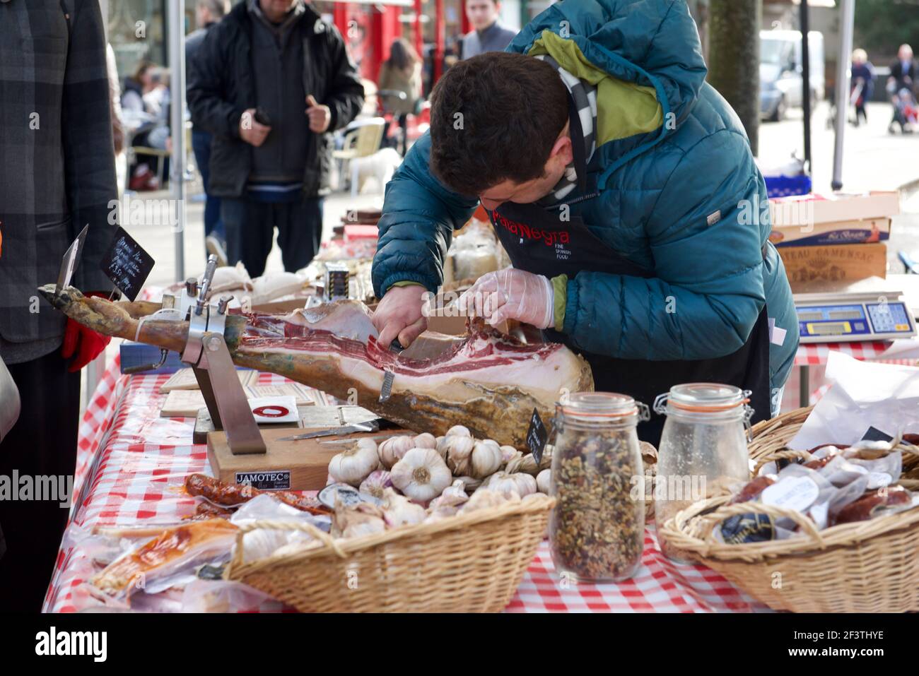 Serrano ham stall at Farmers Market, Wanstead, East London, UK Stock Photo