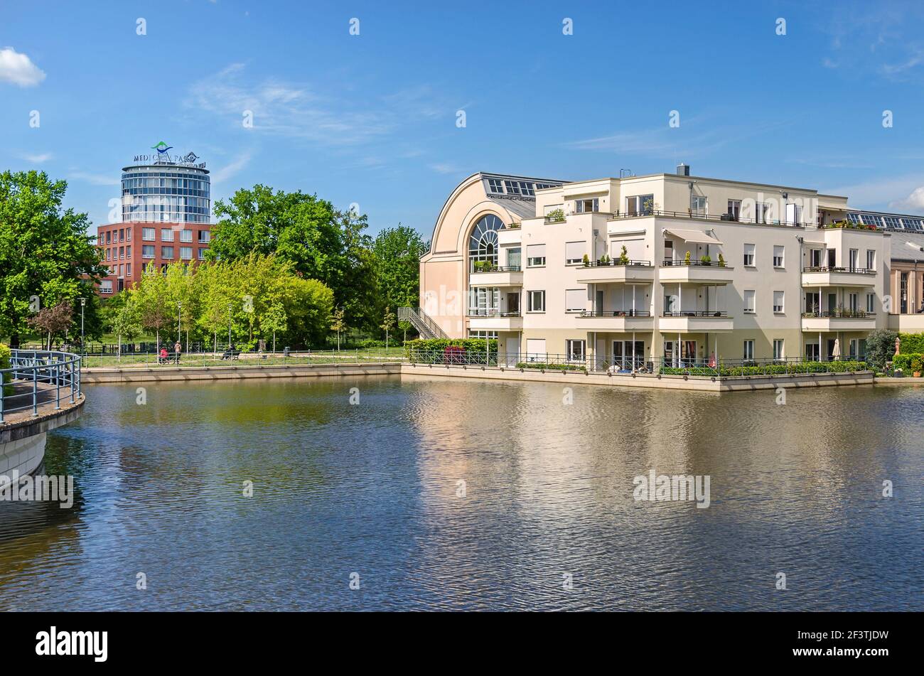 Berlin, Germany - Mai 12, 2019: Harbor basin Tegeler Hafen with buildings of the Humboldt Library and the clinic Medical Park Humboldtmuehle Stock Photo