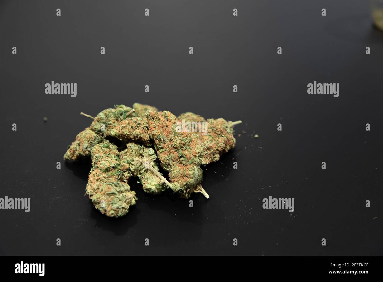 thc or cbd Cannabis buds on a table Stock Photo