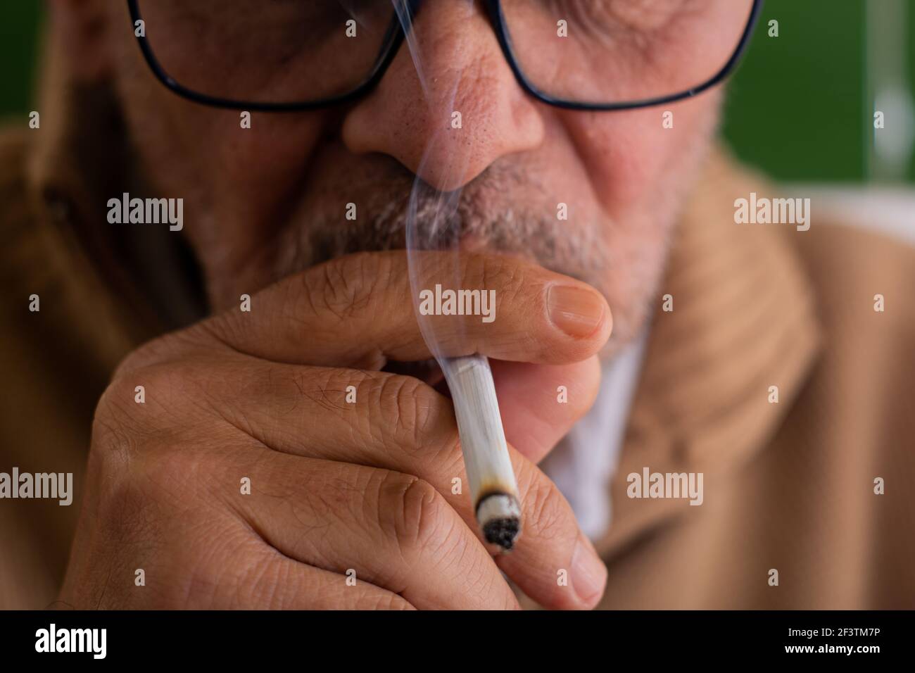 Holding cigarette in mouth hi-res stock photography and images