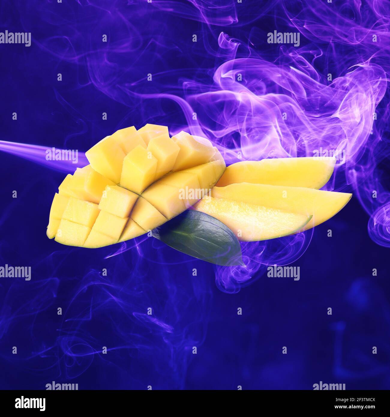 Fresh mango and color smoke on dark background Stock Photo Alamy
