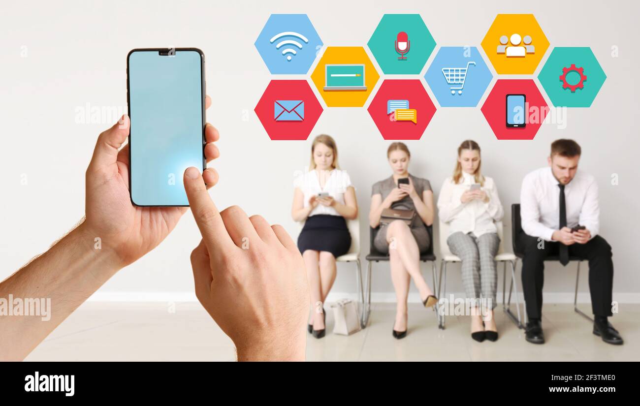 Group of hands holding cell phones hi-res stock photography and images ...