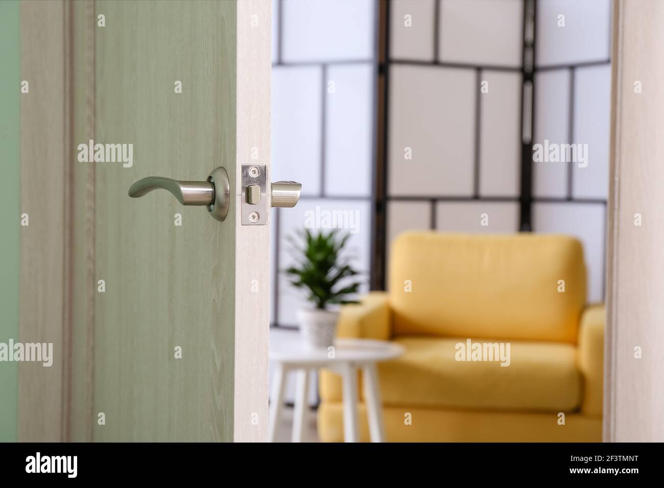 View of living room through open door Stock Photo Alamy
