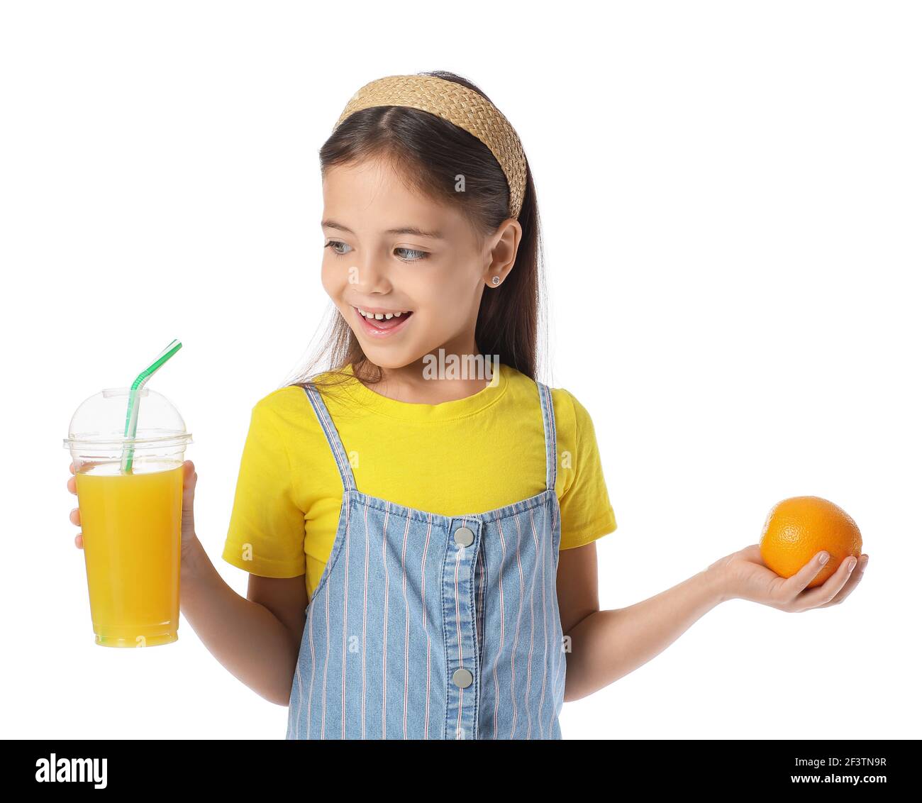 Cute little girl with orange and juice on white background Stock Photo ...