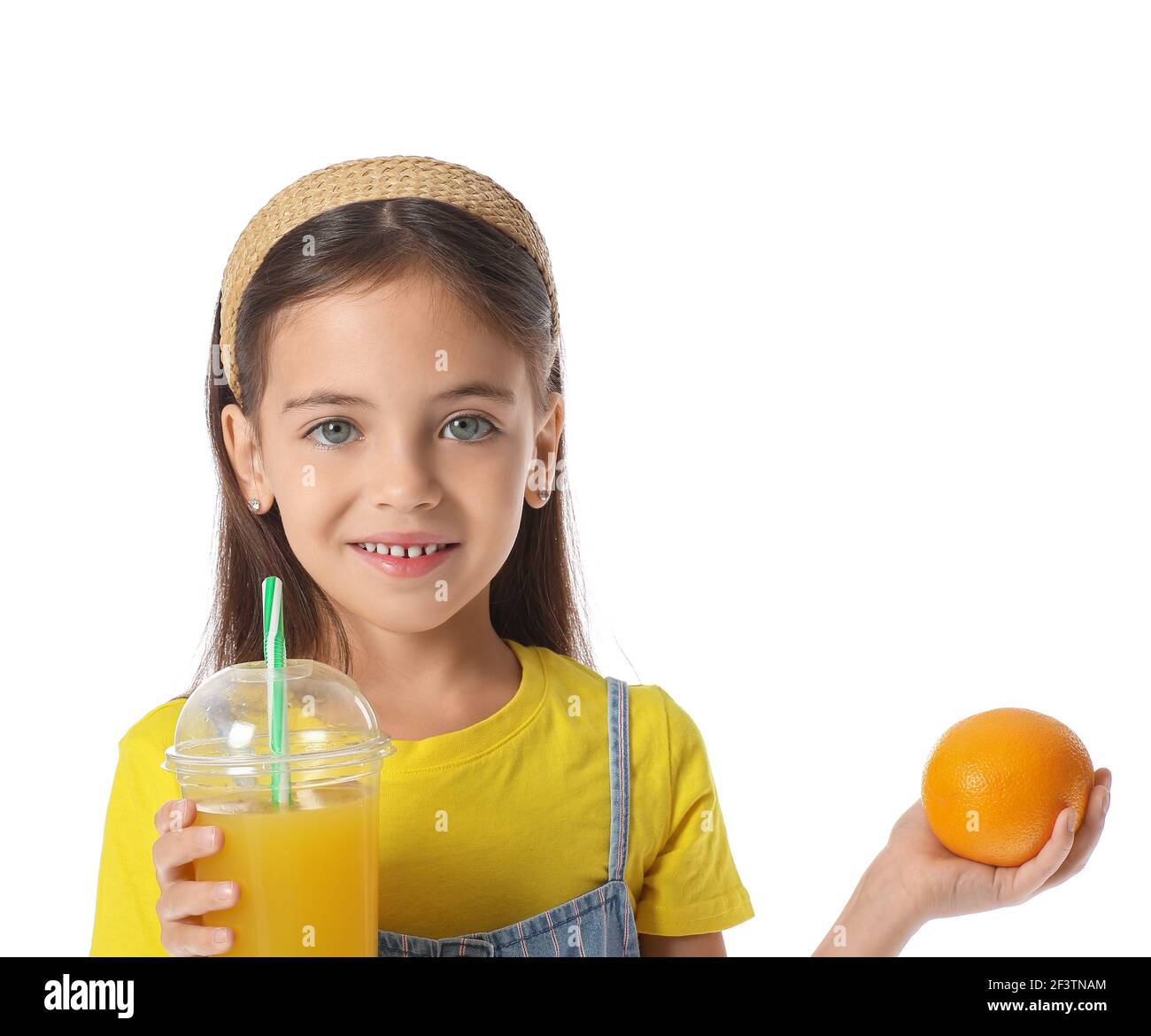 Cute little girl with orange and juice on white background Stock Photo ...